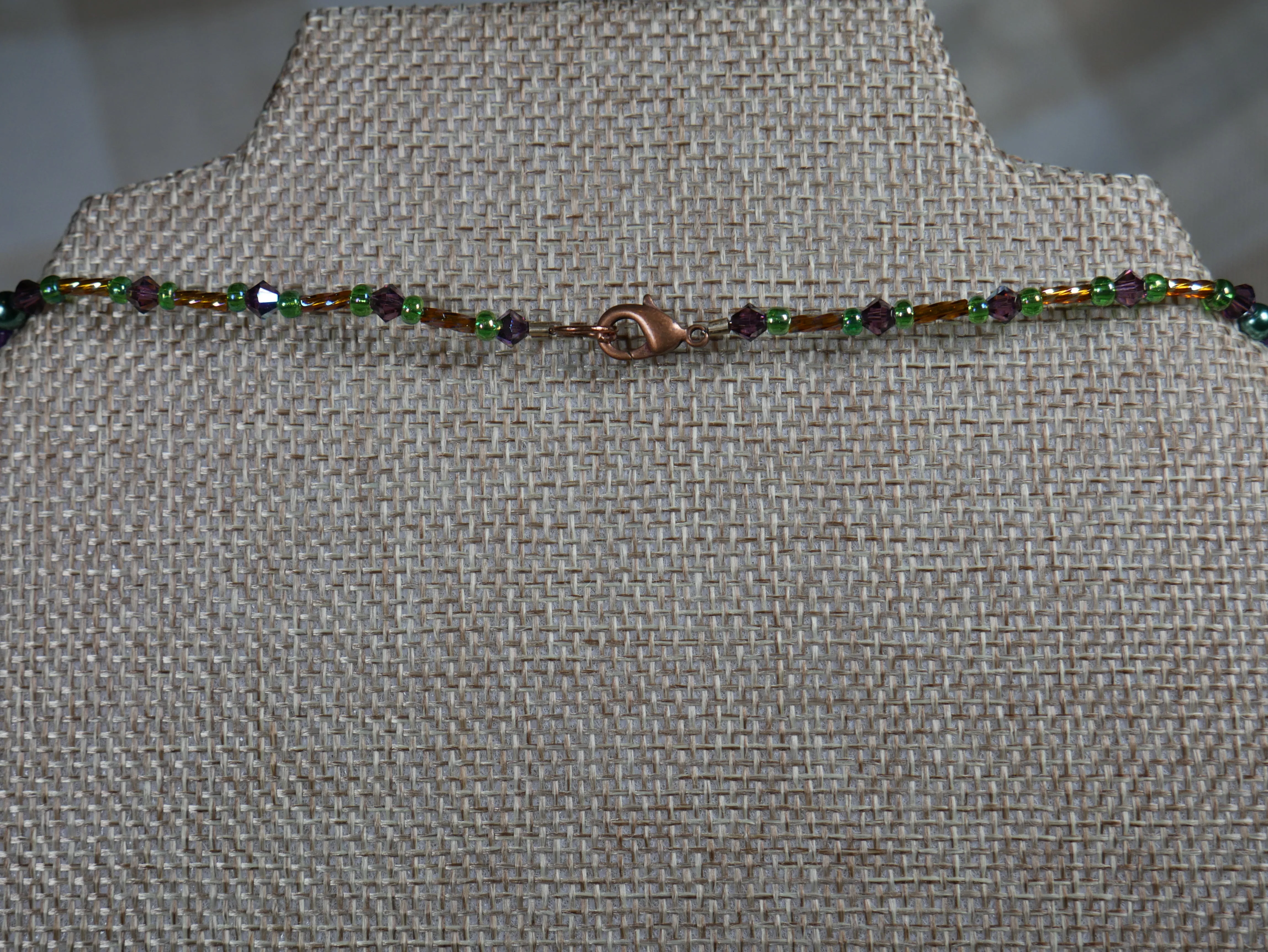 Purple, Green and Gold Beaded Necklace with Bicone Crystals and Crystal Encrusted Accent Bead