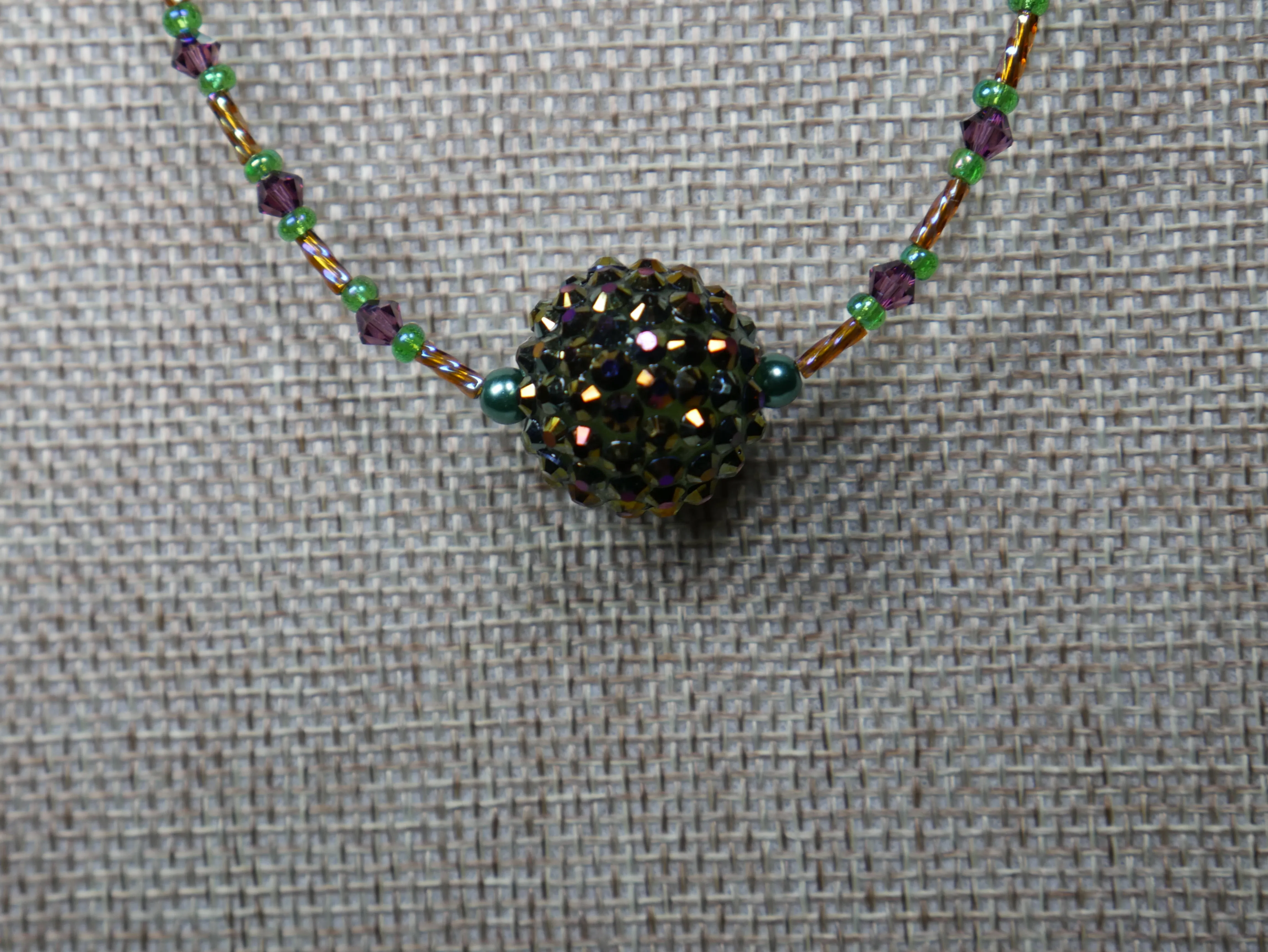 Purple, Green and Gold Beaded Necklace with Bicone Crystals and Crystal Encrusted Accent Bead