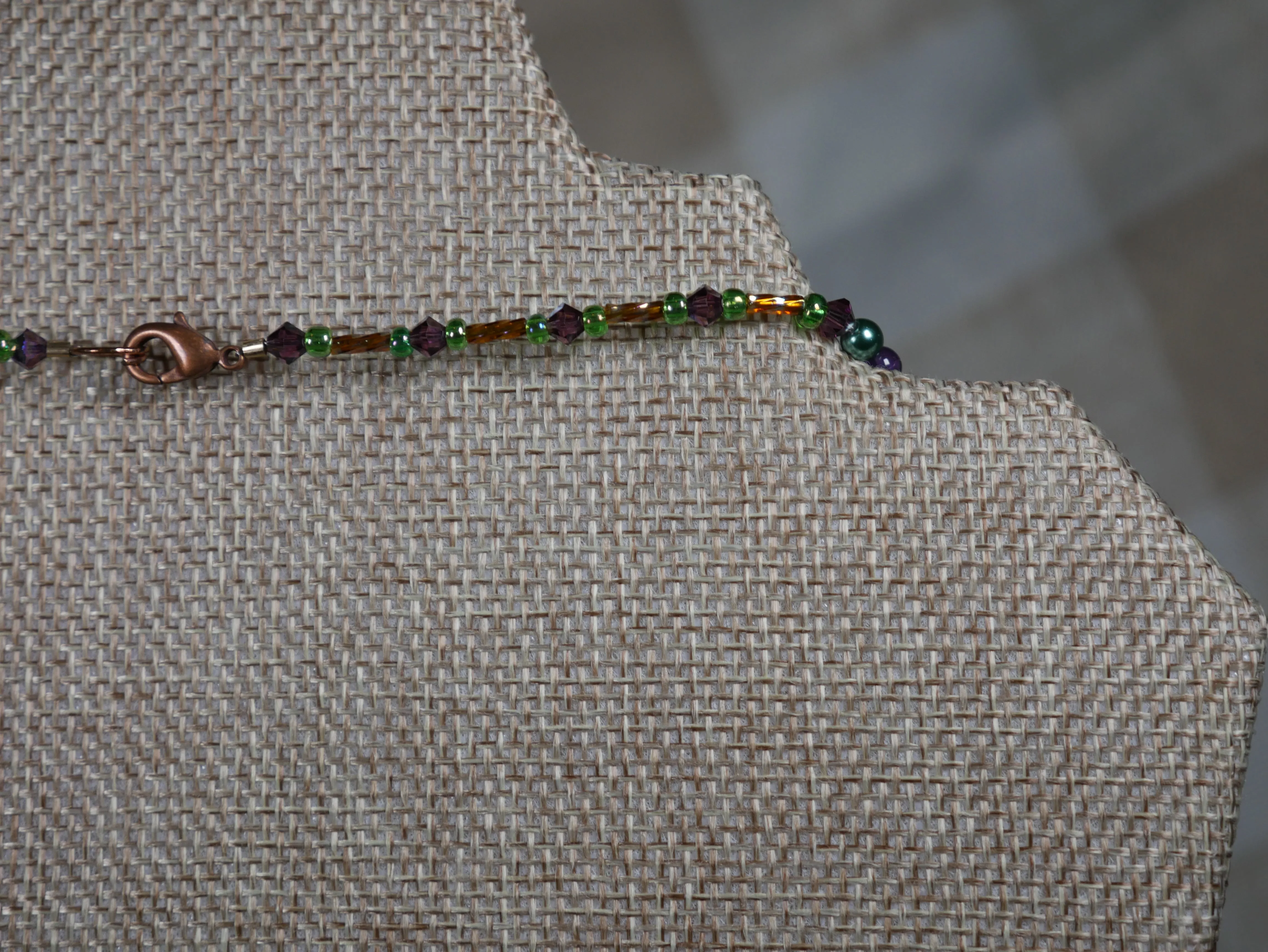 Purple, Green and Gold Beaded Necklace with Bicone Crystals and Crystal Encrusted Accent Bead