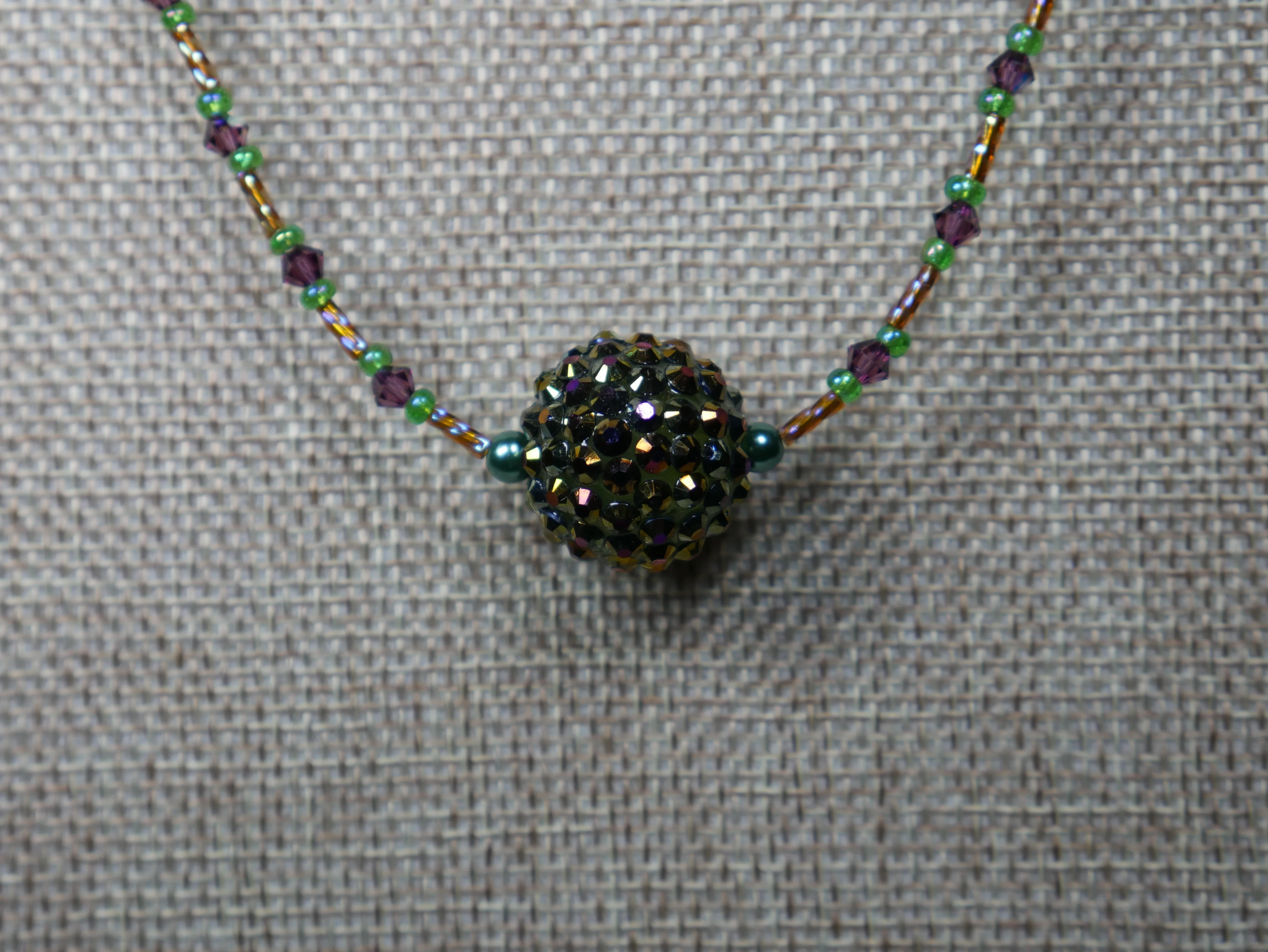 Purple, Green and Gold Beaded Necklace with Bicone Crystals and Crystal Encrusted Accent Bead